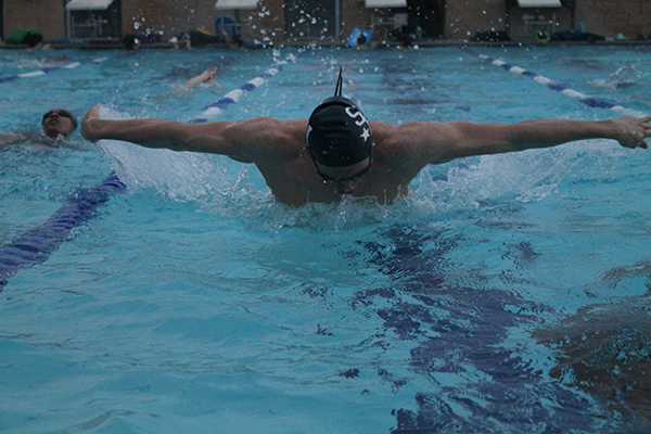 Senior Shaun Besch competing in 50m butterfly swim during practice. The varsity swim squad heads into state competition this Friday in Austin.