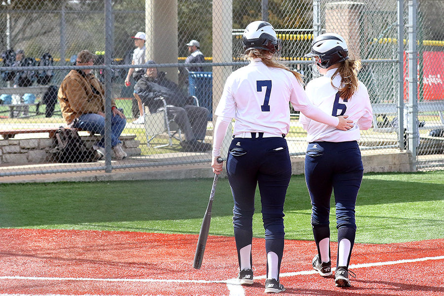 Senior players Hannah Kollmansberger and Presley Smith walk off the field after a game on Feb 25. The gilrs and their fellow seniors have stepped up in the absense of their coach Lisa Daigle.