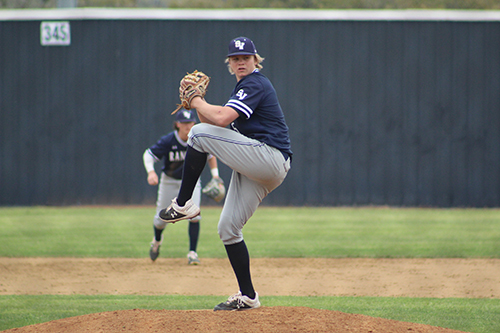 Junior pitcher, Jarek Wells winds-up for a pitch during an early season game.