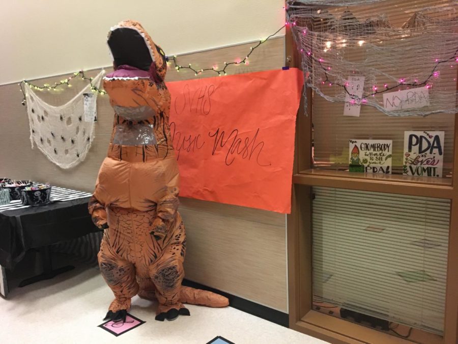 Forget the Monster Mash - piano teacher Alicia Boudier brings out the T-rex costume for the piana classs musical rounds game.