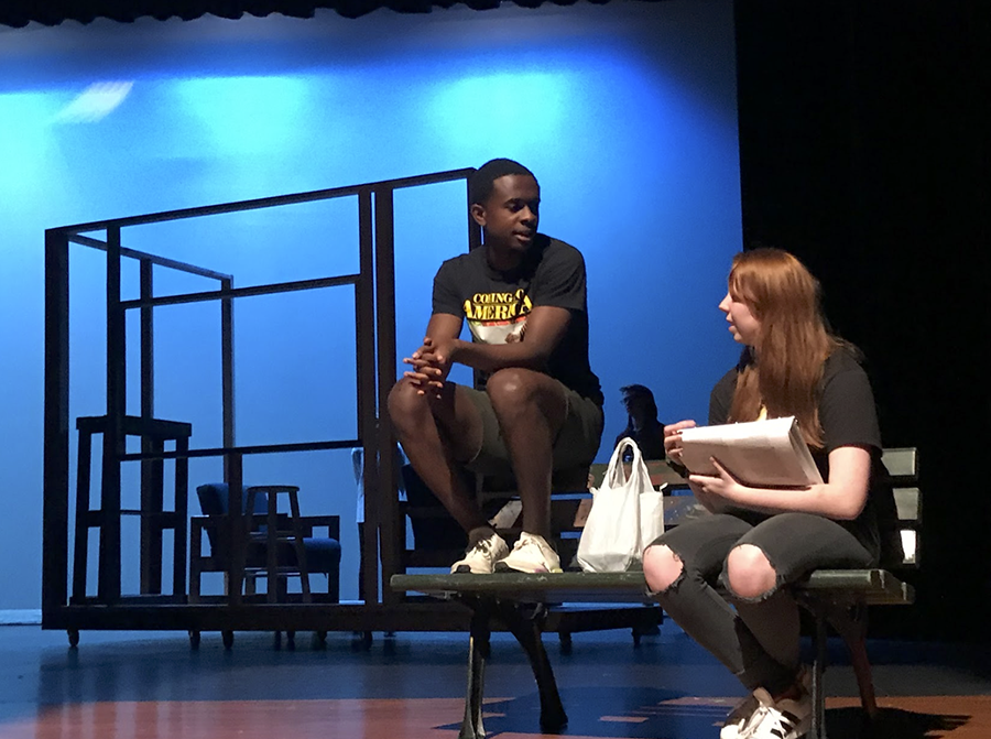 During rehearsal for Middletown, senior Caleb Mosley and junior Brenna Collins converse about their roles.