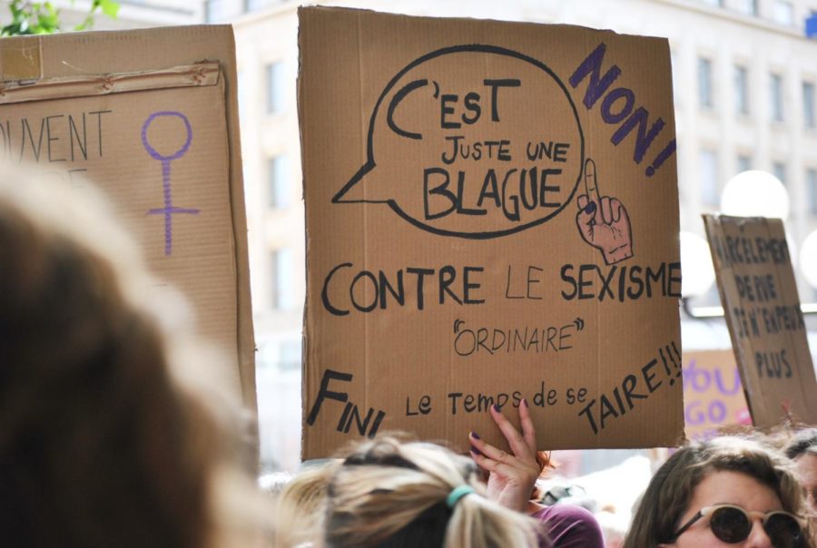 French civilians rally for womens rights in the streets. They are fighting for the equality of all. 