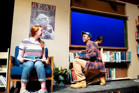 Senior Caleb Mosley (right) talks with junior Brenna Collins (left) during a performance of “Middletown.” Along with his theatrical feats, Mosley also plays varsity basketball.