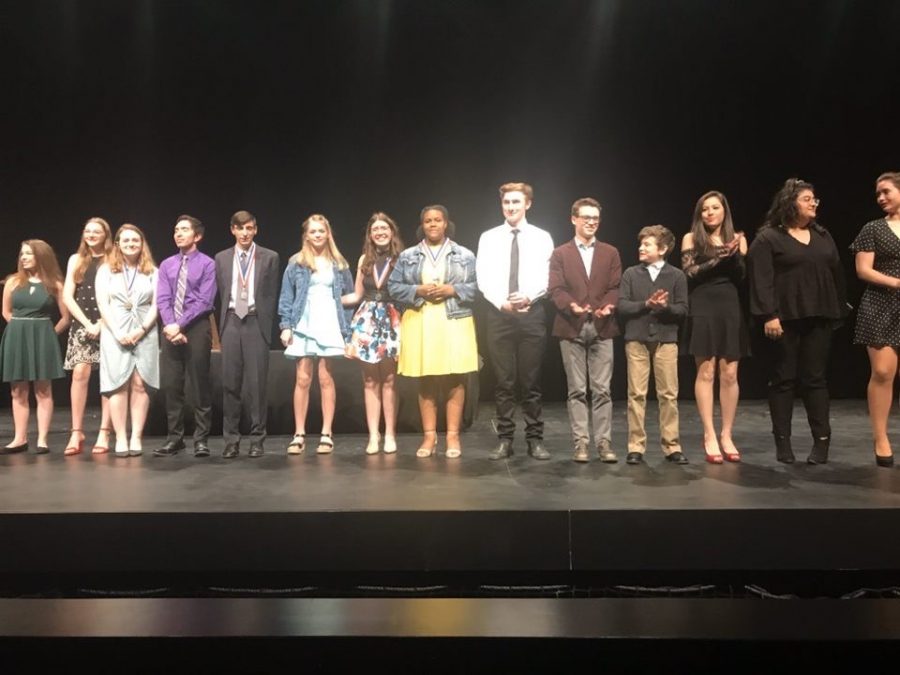 As they stand on the stage, the Clybourne Park cast and crew accept their first place plaque at their most recent contest. 