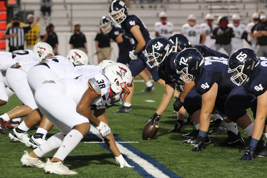 The offensive line sets up against Harker Heights. Football will kick off district play this Friday at Wagner.