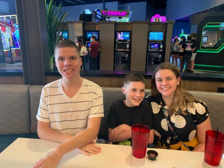 Drew, Jack, and Elle Suermann enjoy a family outing at a bowling alley. 