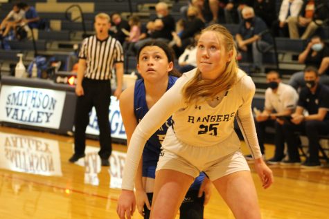 Junior Gabby Elliot shields her South San opponent as she waits for the rebound. Elliot scored 11 points in the Rangers 56-40 loss to the Bobcats.