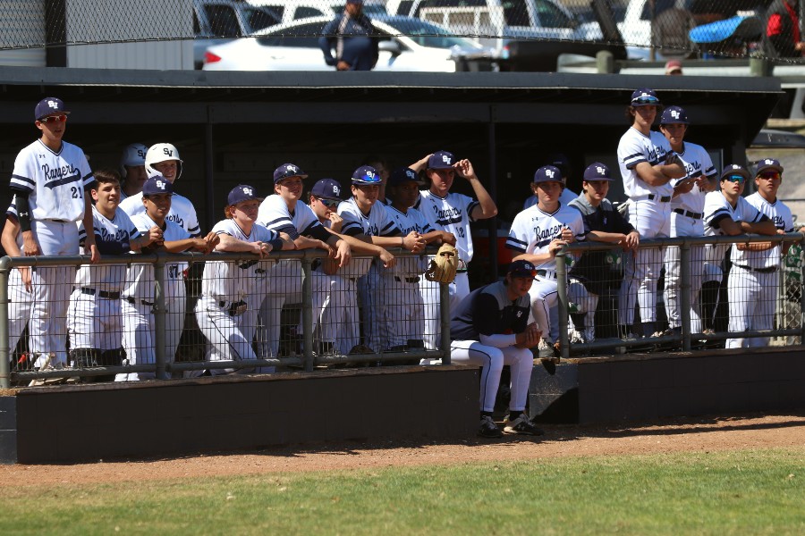 Standing in the dugout, baseball locks in before a game on March 6, 2020. One week later, these players – and others across the state – would lose their respective seasons to COVID-19.