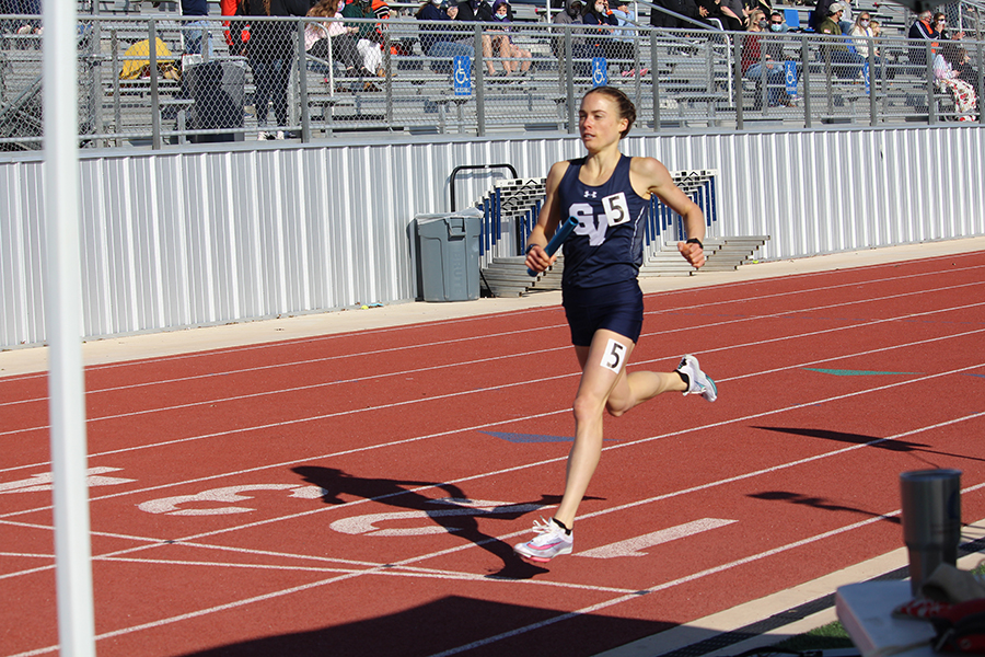Running in the 4X400 relay, senior Amalie Mills takes her strides to the finish line. At the Ranger Relays, she ran the relay after running the mile. The girls  4x400 m relay placed first in the Brenham meet with a time of 4:05.
