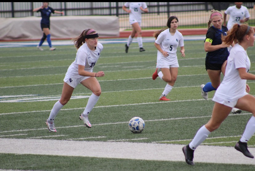 Senior Jewel Mann takes the ball down the field against New Braunfels.  Mann has 14 goals and 10 assists this season.