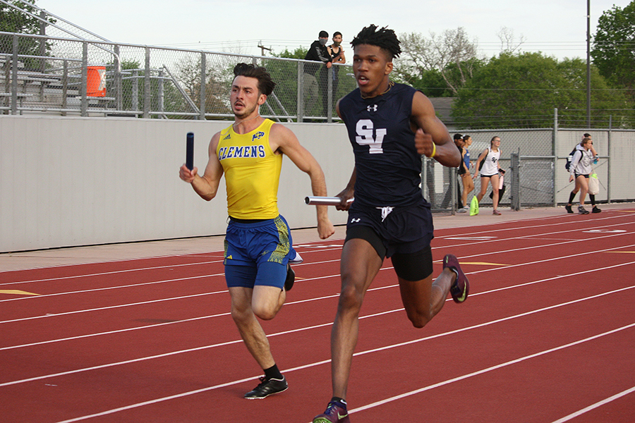 Tevijon Williams races against Clemens at the district track meet. Williams, who is competing with the 4x400 relay this weekend, holds the school record for the 100m (10.55).