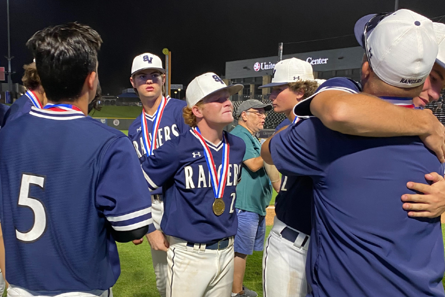 As+his+fellow+seniors+say+their+final+on-field+goodbyes%2C+shortstop+Ryan+Ruff+%28No.+2%29+fights+back+tears.+Baseball+lost+to+Rockwall-Heath+in+the+state+semifinals+on+Friday%2C+8-4.