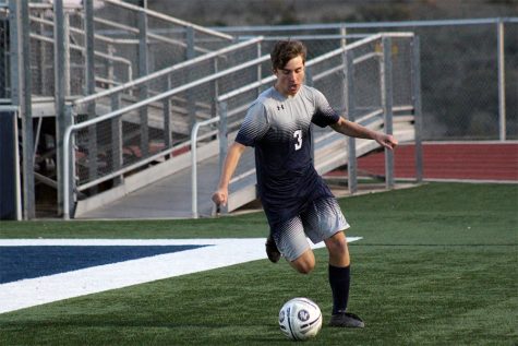 During game play in the spring, sophomore Holland Snell dribbles the ball up the field in Ranger Stadium. Boys and girls soccer practice and play at Ranger Stadium, but their locker rooms are in the main building.