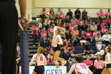 Middle blocker, Alexa Pyle prepares to spike the ball during game against New Braunfels.