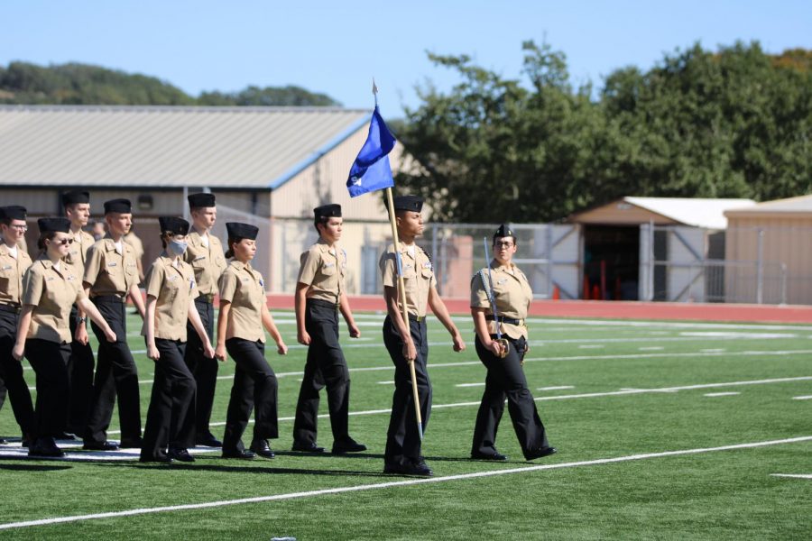 The Junior Reserve Officers Training Corps marched on the football field during the Veterans Day assembly.