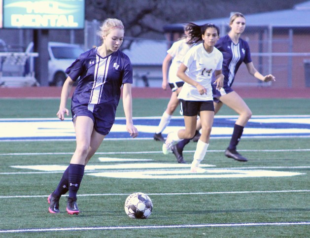 Senior varsity soccer player Katie Svitchan plays in a game last semester.