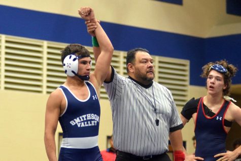 Sophomore Tristan Luna is crowned victorious against his opponent at Roosevelt on Dec. 3.