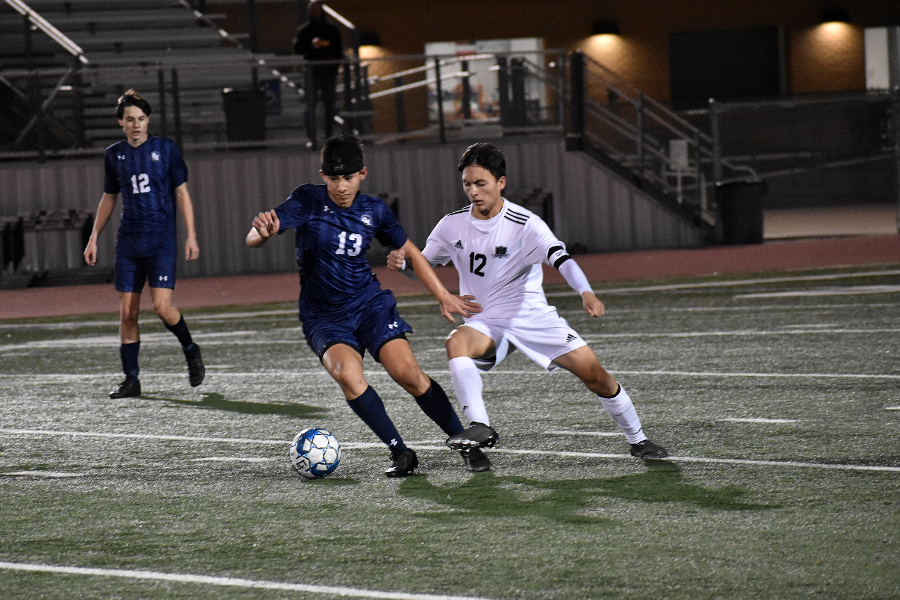 Matthew Capetillo dribbles from a defender during a match against Steele on Feb 15.