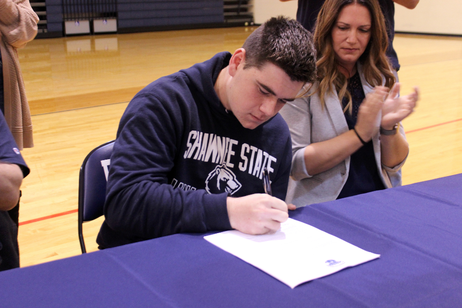 Senior tennis player Dylan Smith signs his commitment to play at Shawnee State University.