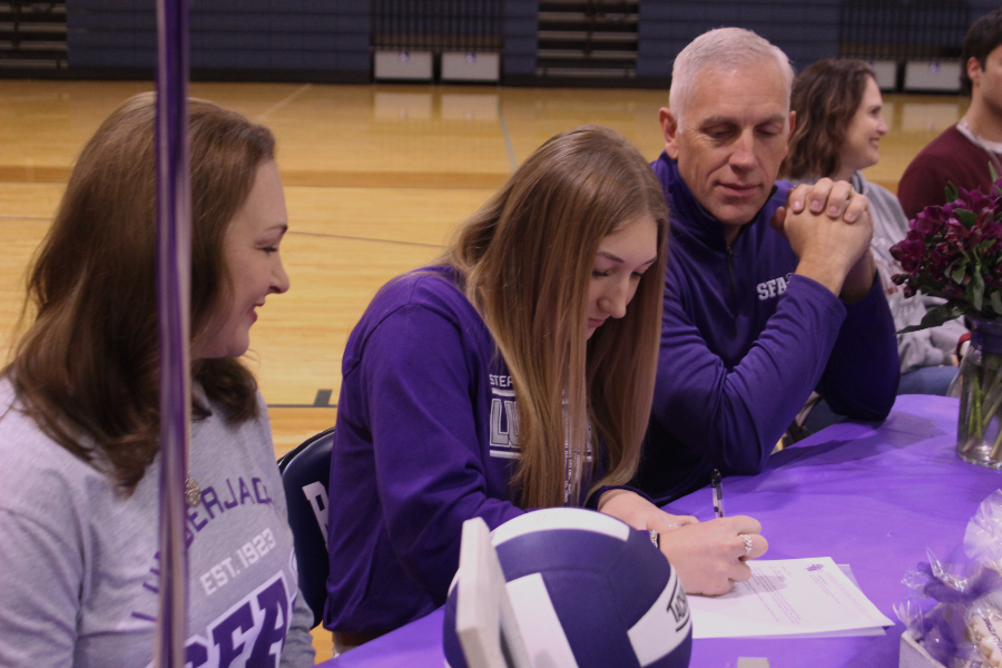Volleyball player Shaylan Wright signs her letter of intent to play at Stephen F. Austin University.