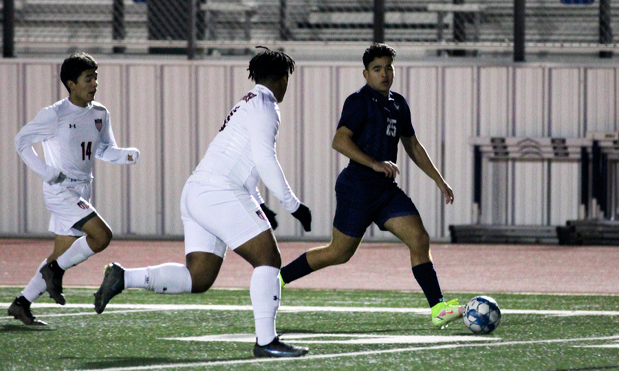 Danny Chavez dribbles away from Wagner defenders during a game on Feb 18. 