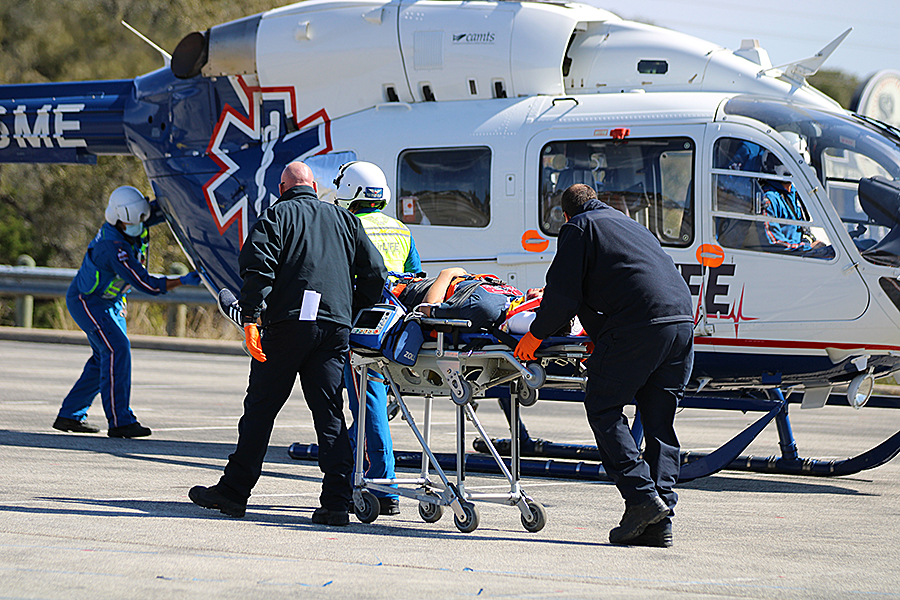 Junior Tyler Stone is taken to an AirLife helicopter after being injured in a car accident.