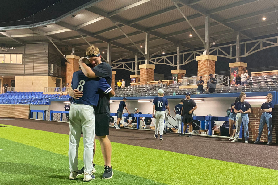Team hype man Colton Thomasson (right) comforts starting pitcher Zach Gingrich after baseballs season-ending loss to Reagan. The Rangers finished the year 28-7, winning a district title and two playoff series along the way.