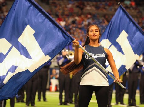 Serenity Lippe performing with the color guard at the Alamodome