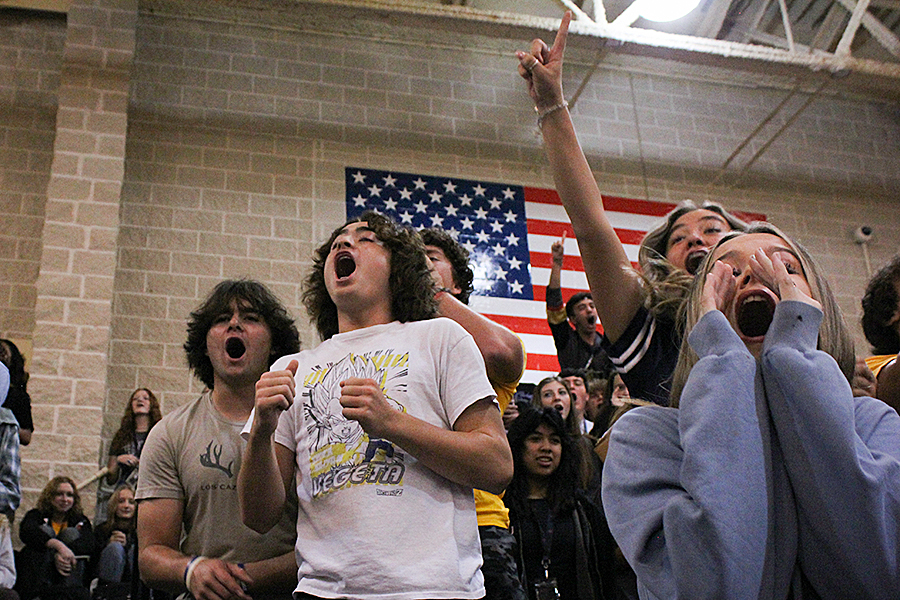 Juniors in the stands compete to win the spirit stick as part of the yell-off competition against the other classes.