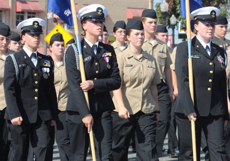 NJROTC+cadets+Aspen+and+Phoebe+Lee%2C+Laureli+Robinson+and+Paige+Day+march+in+the+Comal+County+Fair+Parade+on+Sept.+23.