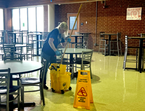 Janitorial staff, Sheila Hubbard, cleaning senior dinning after all lunches have passed.