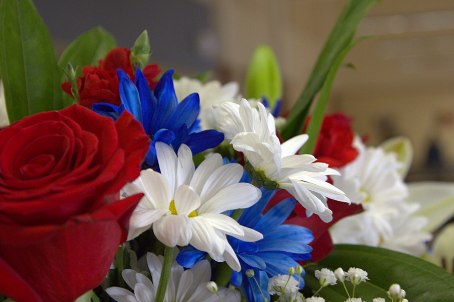 An array of red, white and blue flowers decorate the cafeteria for Fridays breakfast for veterans.