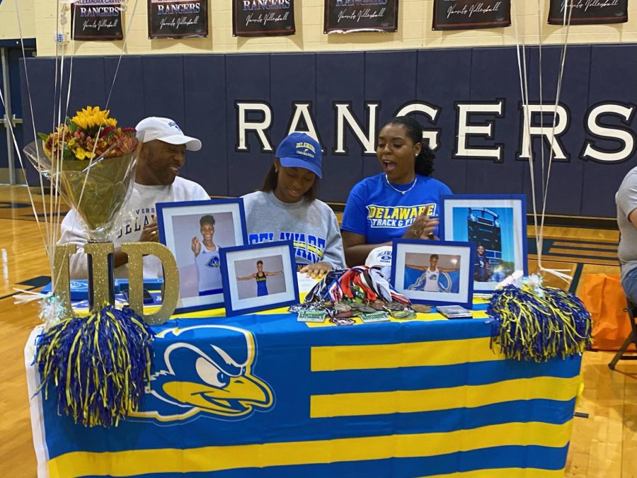 Jacquelyn Rolle signs to run track at the University of Delaware. 