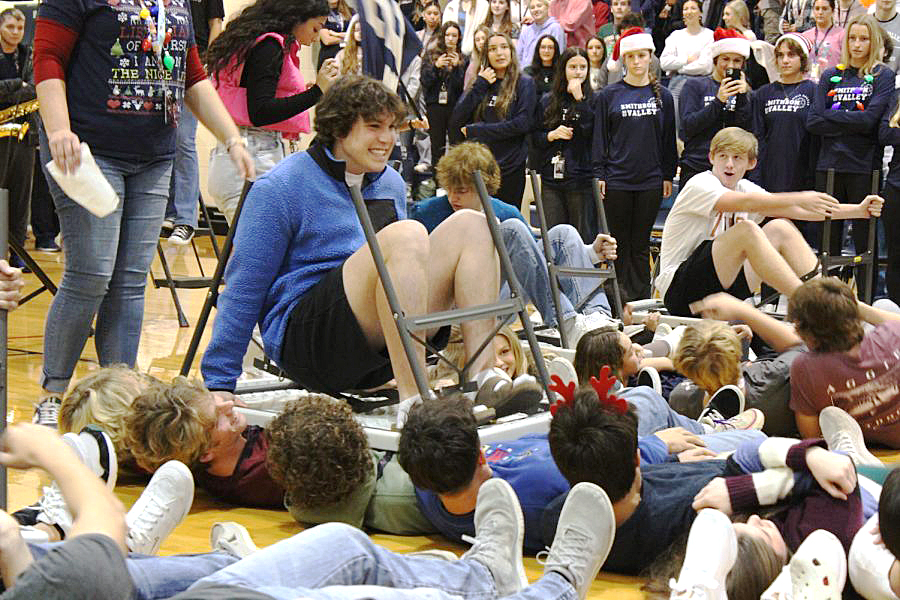 Ryder Bonser and Bylee Bowman running over classmates to get to the finish line at the Dec. 2 pep rally.