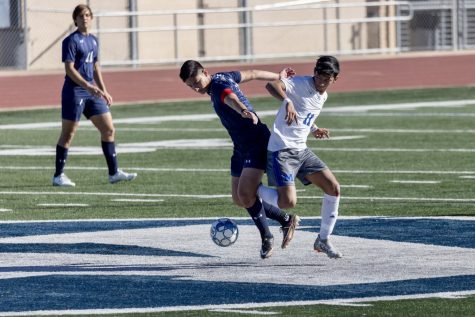 Senior Matthew Capetillo attempts to steal the ball from his opponent. 