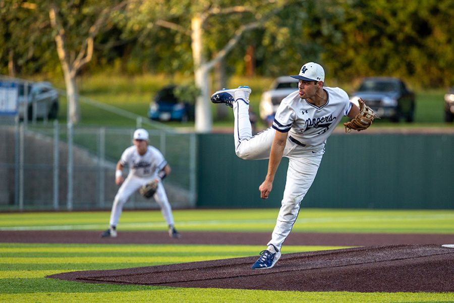 Tim Arguello hurls a pitch in a playoff game against Austin Westlake. On Thursday, Arguello started the Rangers Game 1 loss to Reagan, striking out four batters and allowed no earned runs.