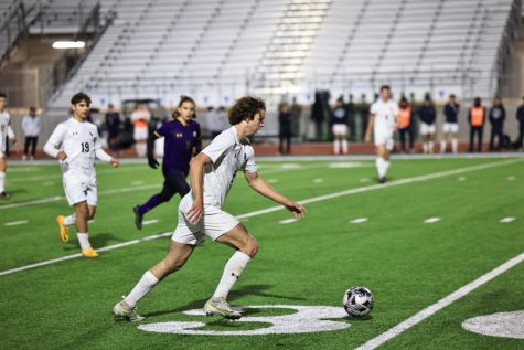 Junior Greg Gelsone dribbles down the field in the Rangers first match against Pieper. The boys beat Pieper out for the second playoff seed. 