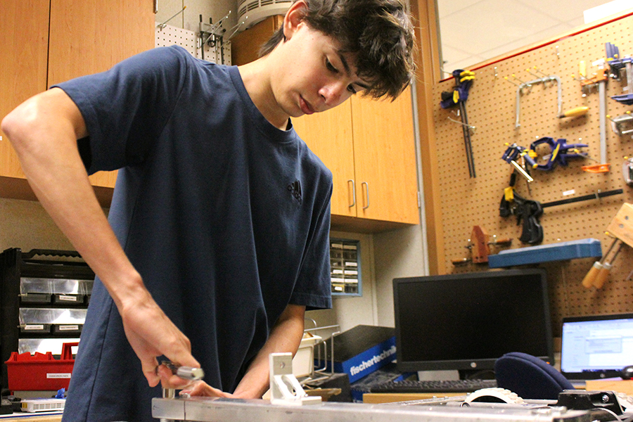 Junior Mario Castillo is one of four members on the robotics team. During their fourth period class, the group works diligently on their projects.