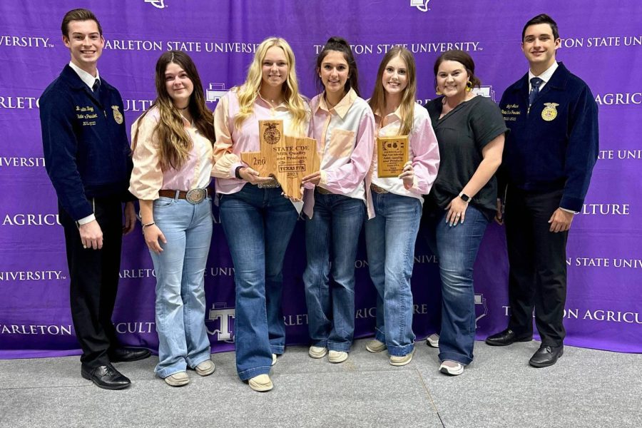 Abby Permenter (right) with the milk quality judging team at their state competition.