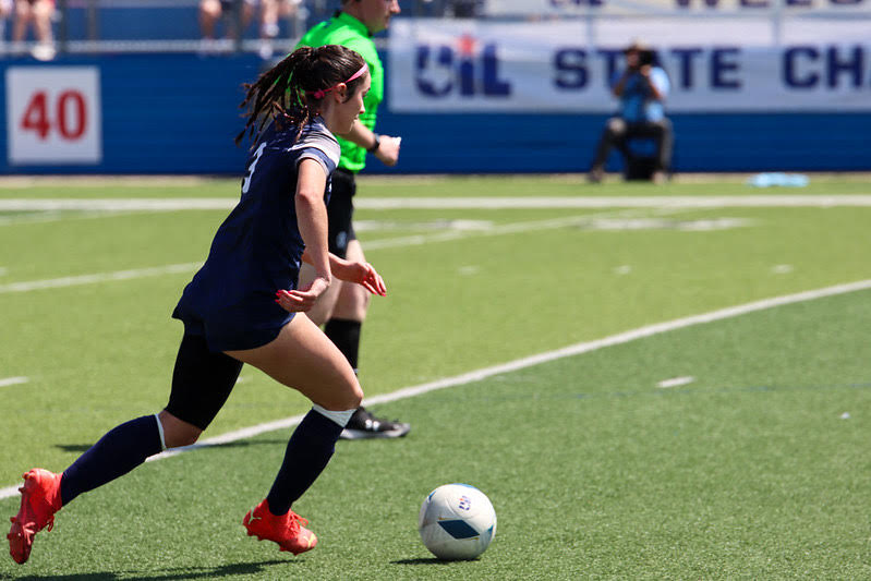 Senior Arianna Monnin dribbles the ball to the midfield and looking for the forwards against Graoevine Thursday in the state semifinals at Georgetown.