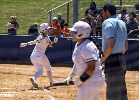 Senior Abby Brand crosses the plate during Saturdays second game at home. After taking a loss on Friday, the girls won the best-of-three series with a 6-3 win (on a grand slam homerun) in Game 2 and a 4-2 victory in Game 3.