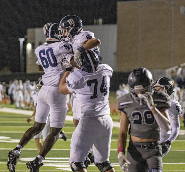 Football celebrates yet another touchown in the 49-14 victory over Boerne Champion Oct. 13. 