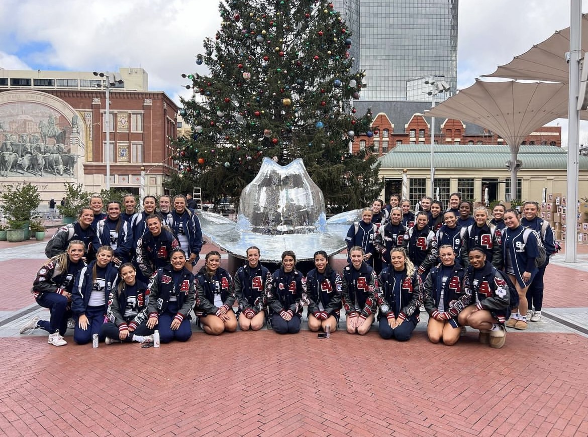 The varsity cheer team poses for a photo in Fort Worth while at the state competition. Photo via @svrangercheer on Instagram.