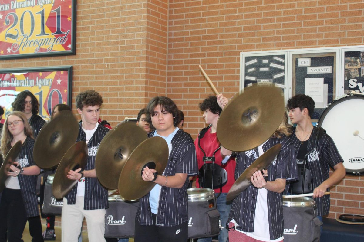 Drumline lines the main entrance and plays their favorite stadium songs.