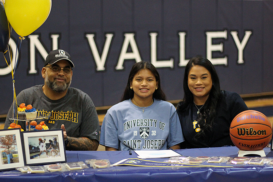 Senior Daichelle San Nicolas, a two-year varsity basketball point guard, signs with University of St. Joseph. 