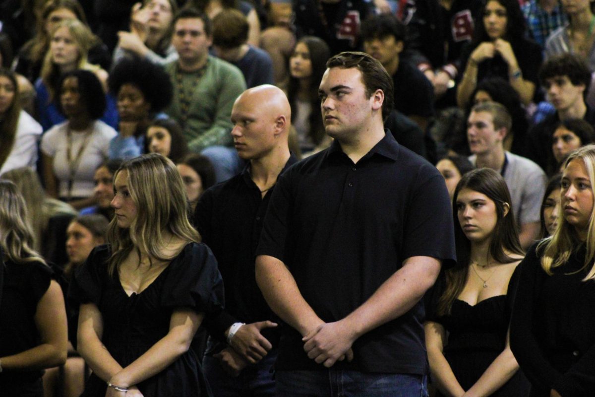 Senior Truman Davis stands with the other broken hearted friends who represent the loved ones people leave behind when they pass at the Shattered Dreams mock funeral March  8. Davis had two departed friends.