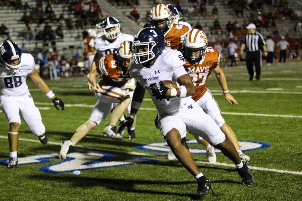 Sophomore Cale Peagler runs down the field during last week's game against Madison. Peagler scored a 4-yard rushing touchdown in the fourth quarter.