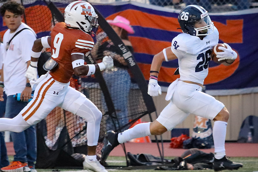 Running back Brad Sowersby scores one of his four touchdowns in the 65-0 win over the Madison Mavericks Friday at Comalander Stadium. 