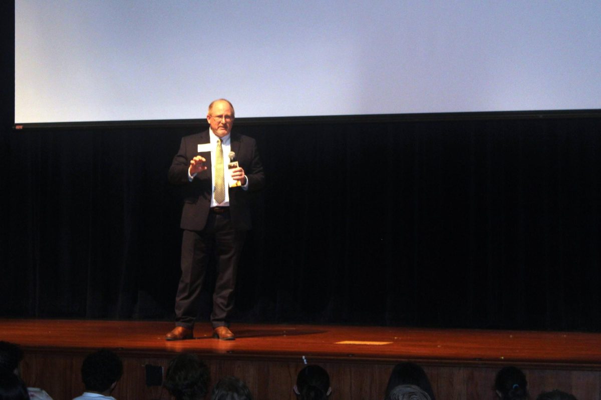 At the constitution day assembly, local judge explains to students the rights given to them through the Bill of Rights.