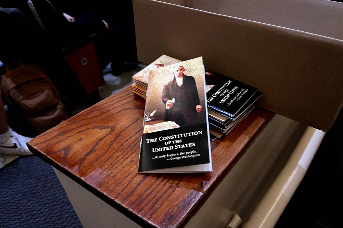 Boxes of pocket constitutions lined the sides of the auditorium for seniors to take one. The constitutions were stamped by local state representative Carrie Isaac.